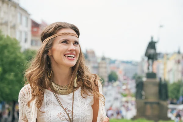 Portrait of longhaired hippy-looking woman tourist  in Prague