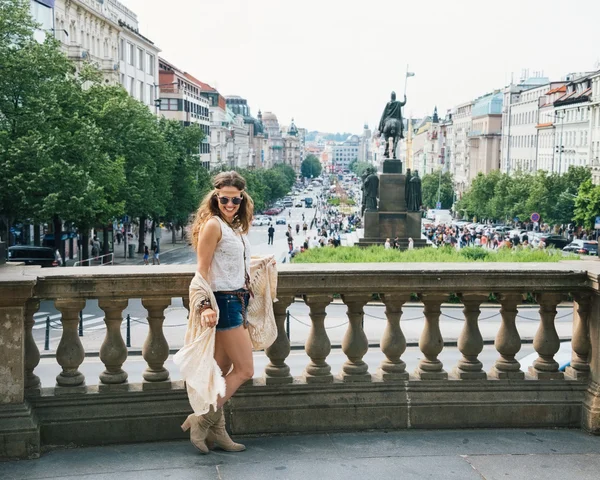 Trendy hippie woman tourist walking on Wenceslas Square, Prague — стокове фото