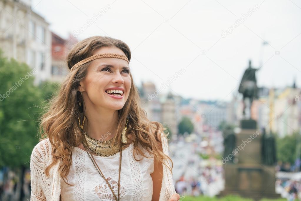 Portrait of longhaired hippy-looking woman tourist  in Prague