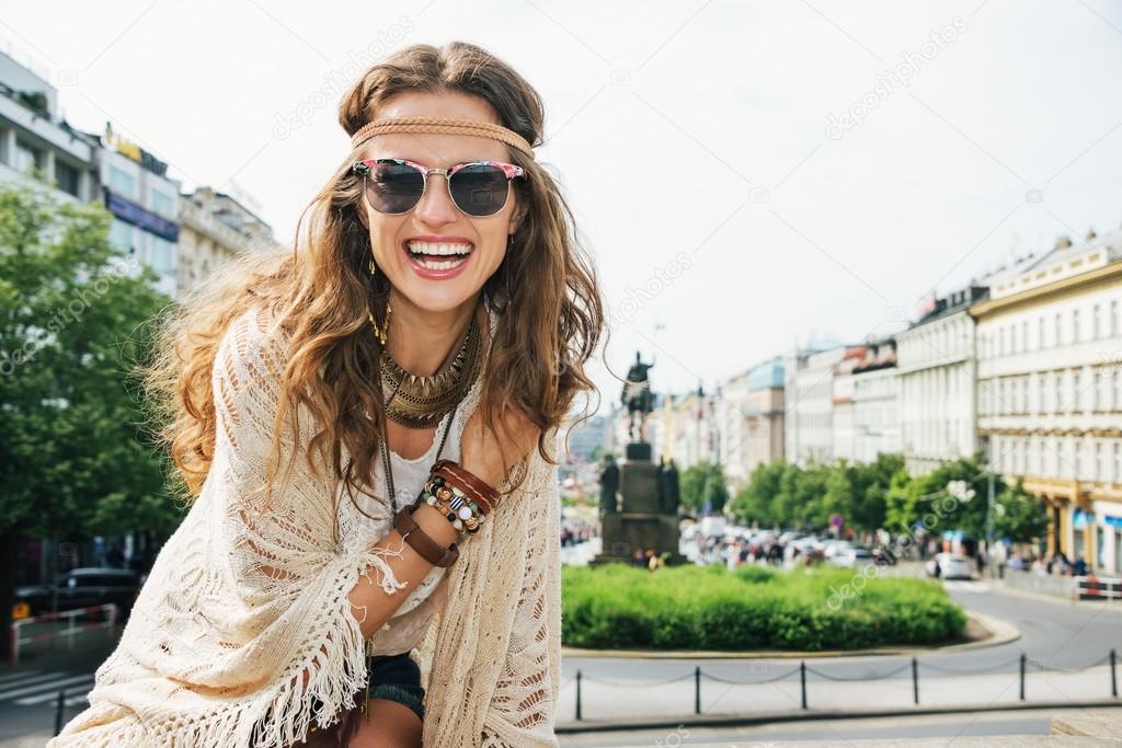 Portrait of smiling young woman wearing boho clothes in Prague