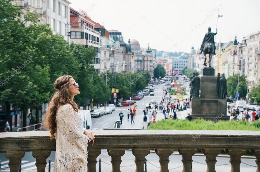 Bohemian woman tourist sightseeing on Wenceslas Square in Prague