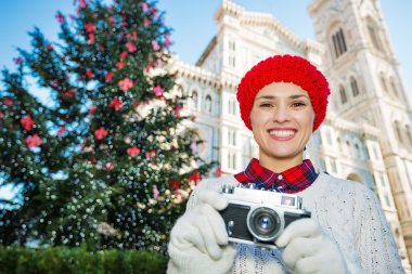 Woman with camera standing near Duomo in Christmas Florence