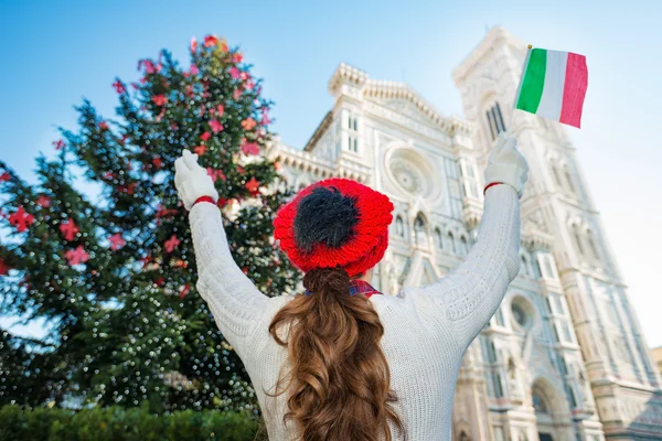 Seen from behind, woman tourist in Christmas decorated Florence — стокове фото