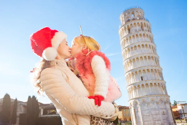 Mother and daughter spending Christmas time in Pisa, Italy