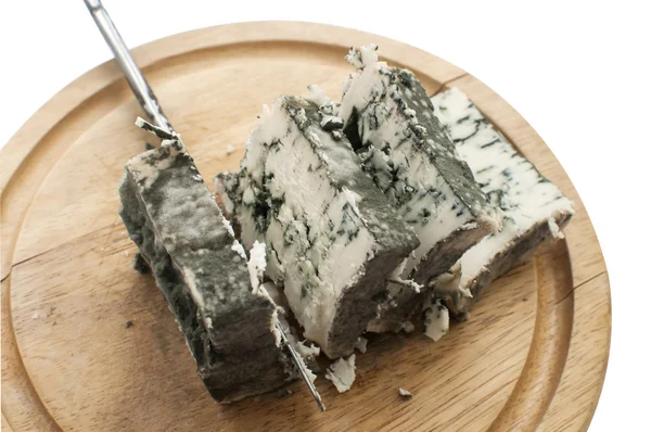 Sliced moldy lump of cheese — Stock Photo, Image