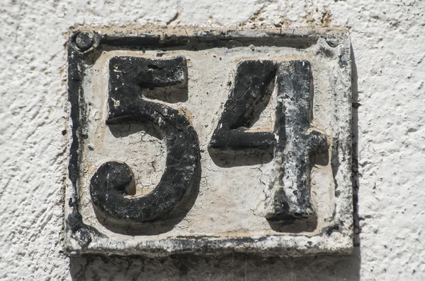 Old retro cast iron plate number 54 — Stock Photo, Image