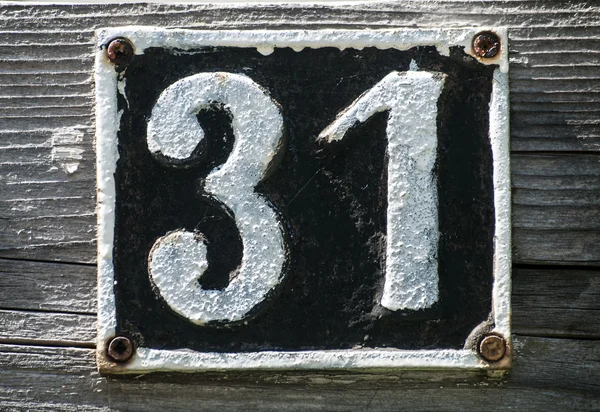 Placa de hierro fundido retro viejo número 31 — Foto de Stock