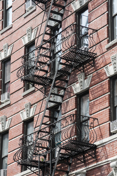 External fire escape staircase on old brick building