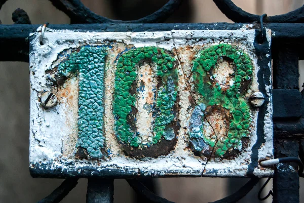 Old Retro Weathered Cast Iron Plate Number 108 Closeup — Stock Photo, Image