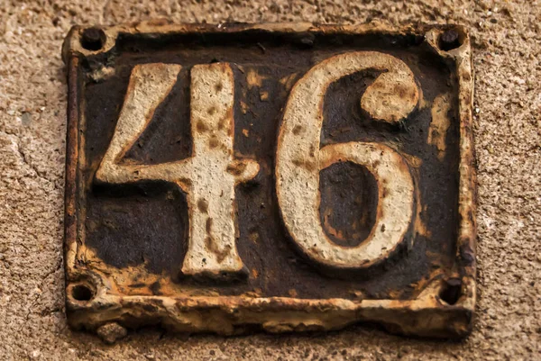 Old Retro Weathered Cast Iron Plate Number Closeup — Stock Photo, Image