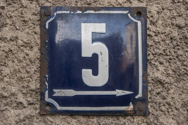 Weathered grunge square metal enamelled plate of number of street address with number 5