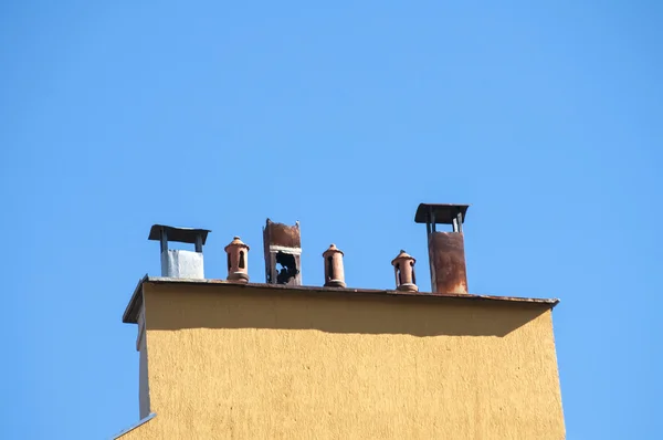 Chimney section of yellow house — Stock Photo, Image