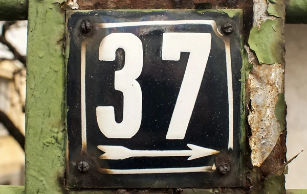 Weathered enameled plate number 37 — Stockfoto