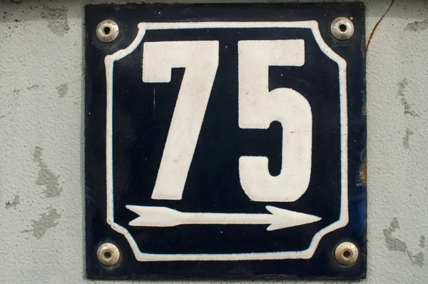 Weathered enameled plate number 75 — Stock Photo, Image