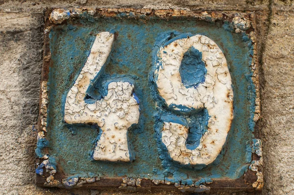 Old retro cast iron plate number 49 — Stock Photo, Image