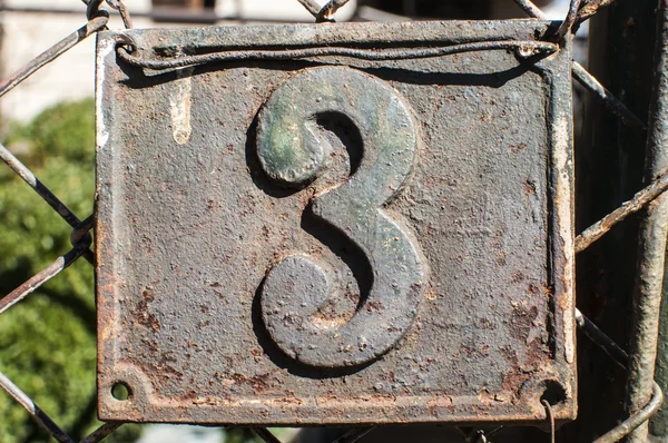 Old retro cast iron plate number 3 — Stock Photo, Image