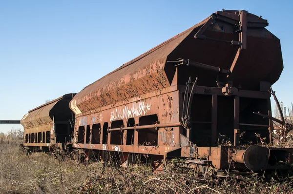 Old abandoned metal freight wagon — Stock Photo, Image