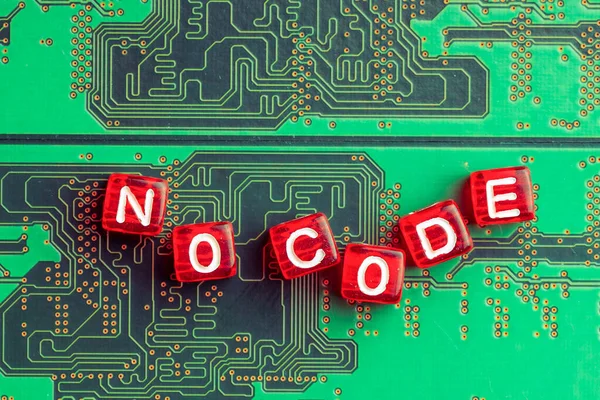 no code lined with letters on red cubes background microcircuit green, cubes are not laid out evenly