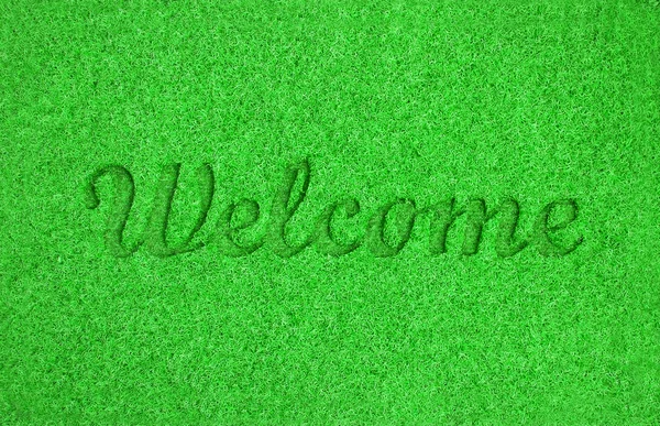 Green welcome mat
