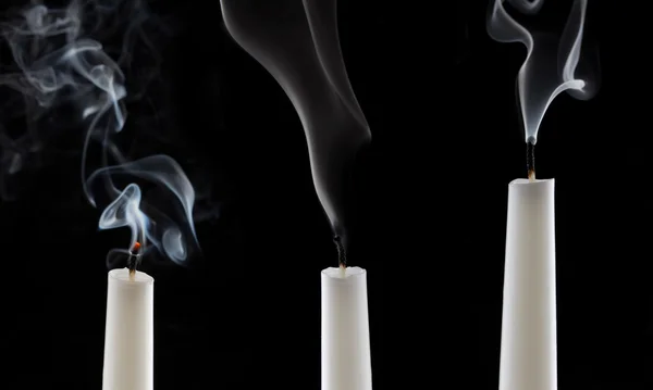 Extinguished candles with smoke