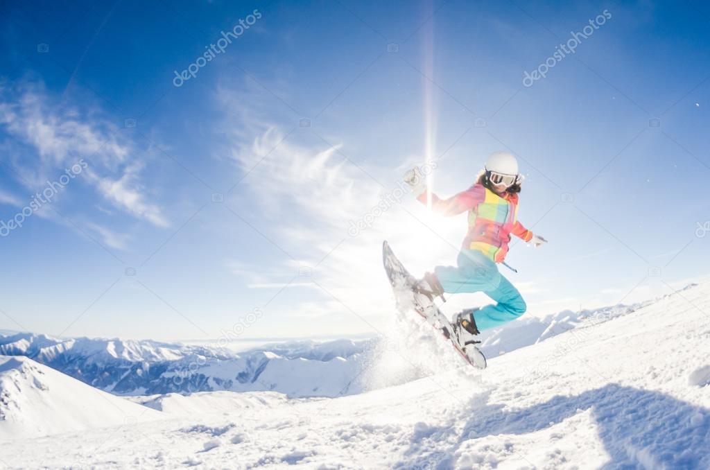 Girl having fun on her snowboard