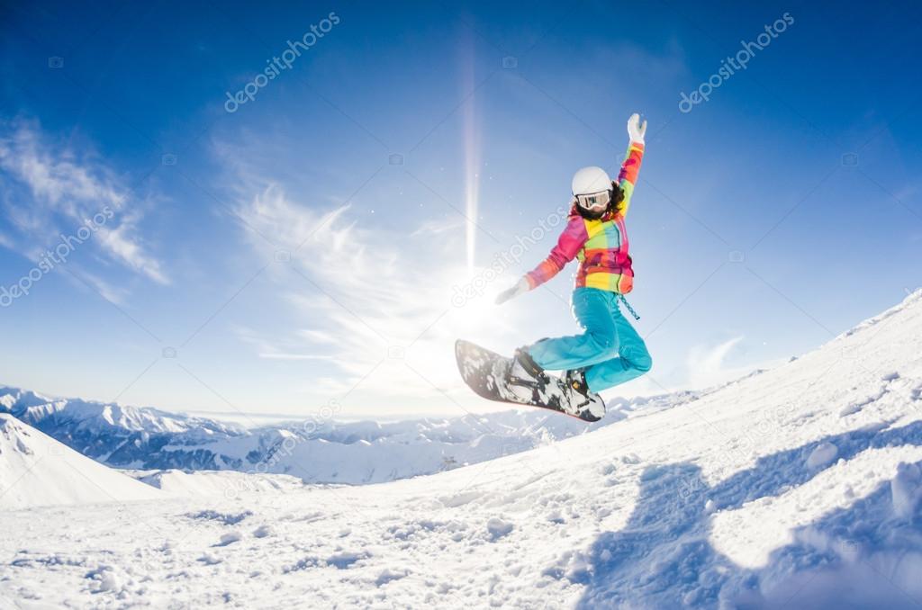 Girl having fun on her snowboard