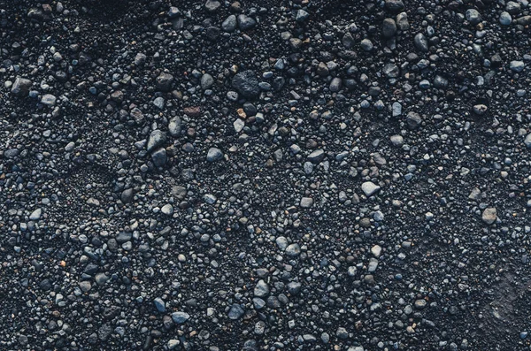 Black pebbles texture — Stock Photo, Image