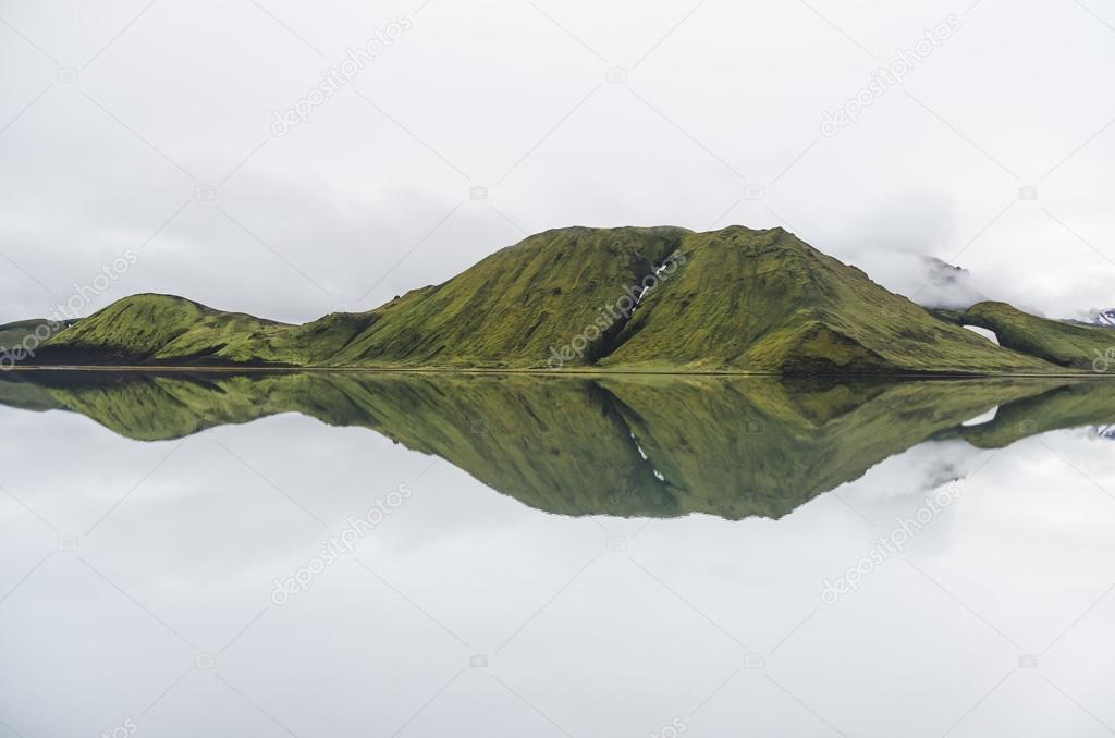 mountain range reflecting in a lake