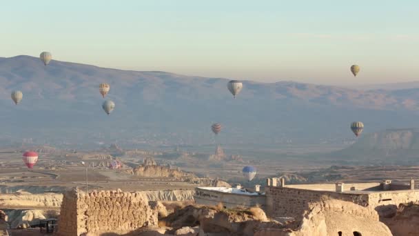 Cappadocia Turkey - October 30 2019: Hot air balloon flying over rock landscape at Cappadocia Turkey. — Stock Video