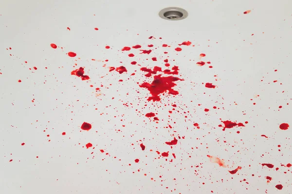 Blood draining from white bathroom basin. Bloody stains in the waterbasin hole. — Stock Photo, Image