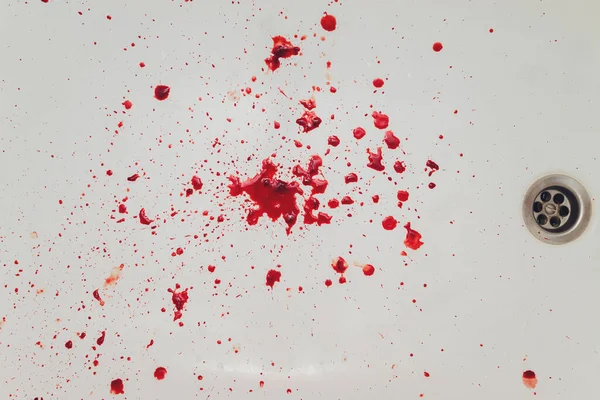 Blood draining from white bathroom basin. Bloody stains in the waterbasin hole. — Stock Photo, Image