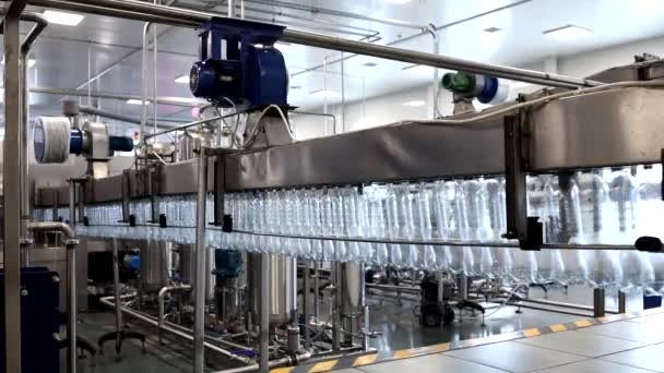 Production of Technical Fluids. Industrial Automated Mechanism for Prepare Plastic Bottles. Chemicals Production Line. Row of Plastic Bottles Moves along the Converyor Closeup. — Stock Video