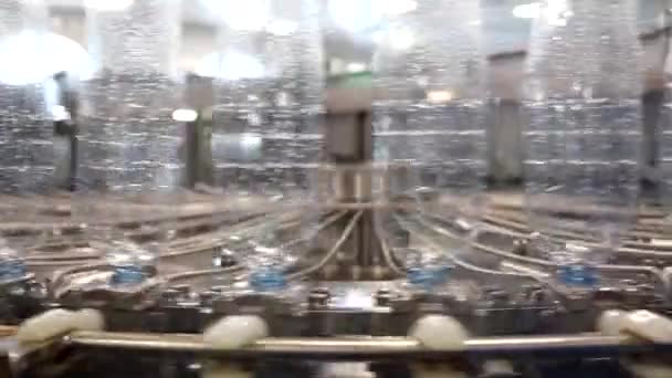 Production of Technical Fluids. Industrial Automated Mechanism for Prepare Plastic Bottles. Chemicals Production Line. Row of Plastic Bottles Moves along the Converyor Closeup. — Stock Video