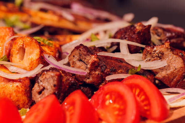 Grilled pork ribs barbeque with vegetables and onion.