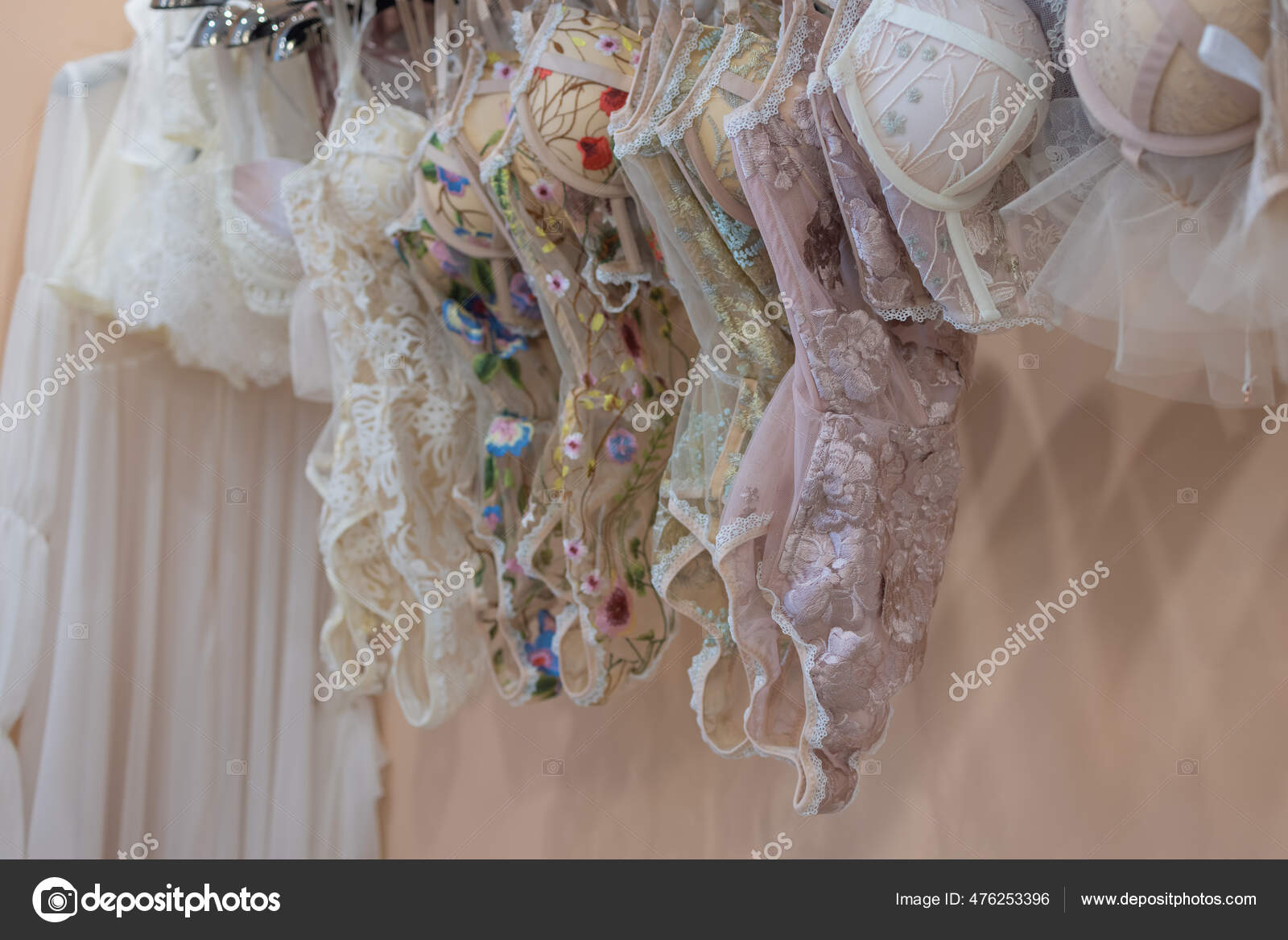 Row of bras hanging in lingerie store. Stock Photo by ©vershinin.photo  476253396