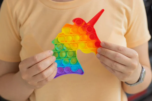 Woman using pop it fidget toy closeup. — Fotografia de Stock