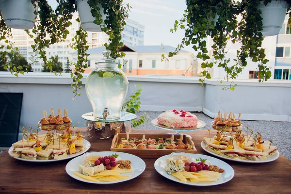 Luxury food and drinks on wedding table. Shallow DOF.