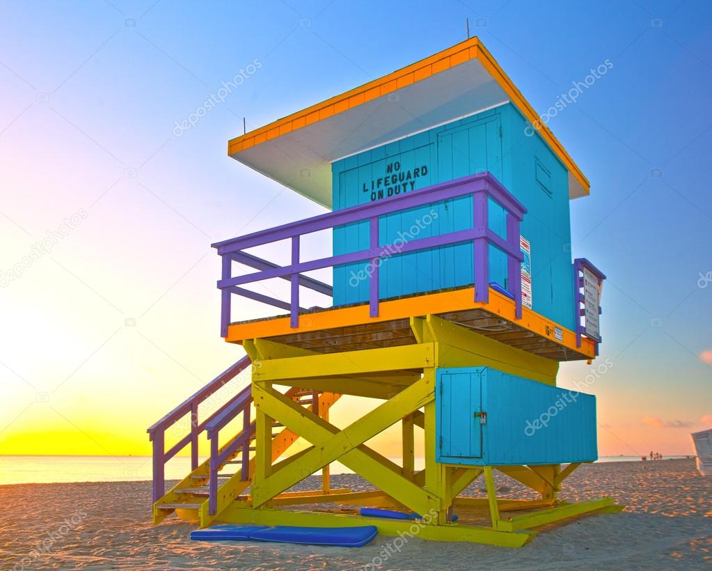 Sunrise in Miami Beach Florida, with a colorful lifeguard house