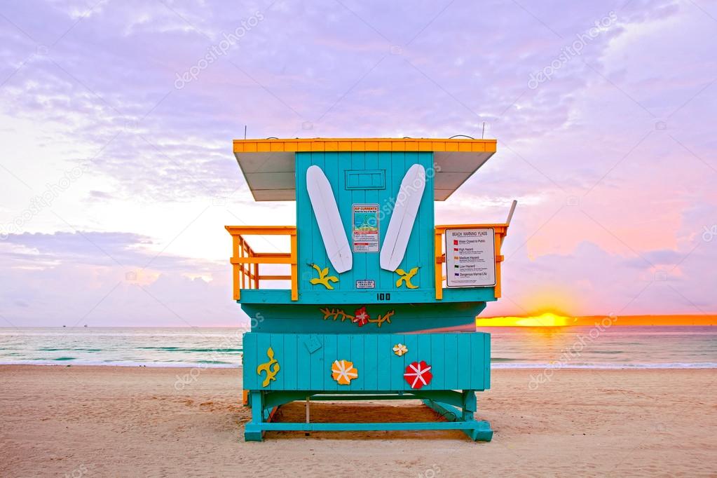 Sunrise in Miami Beach Florida, with a colorful lifeguard house