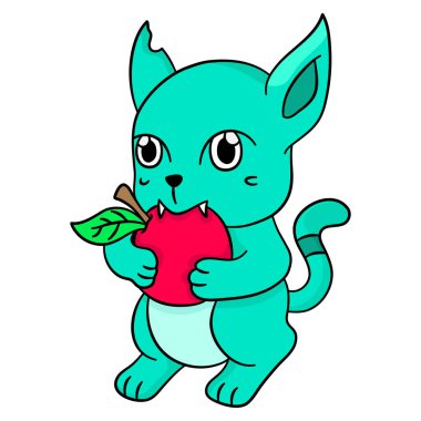 Küçük şirin kedi elma yiyor.