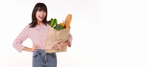 Happy Asian Woman Holding Paper Bag Full Fresh Vegetable Groceries — Stockfoto