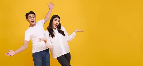 Surprise Young Asian Couple Man Woman Happy Amazed Panoramic Yellow — стоковое фото