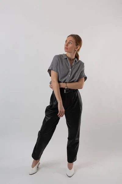 stock image Fashionable girl in a business suit posing on a white background