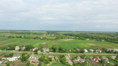 Countryside aerial view with farms, fields and pastures in summer