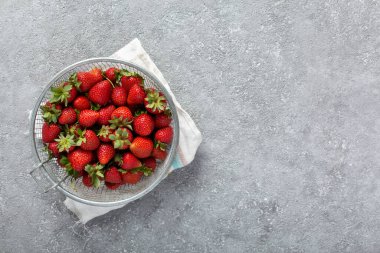 Eco-friendly strawberries on gray background with copy space