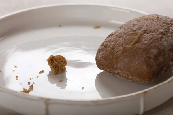 Bread and crumbs on the dining table, close up