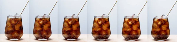 rum with cola and ice in a glass close-up, cola with ice. summer drink