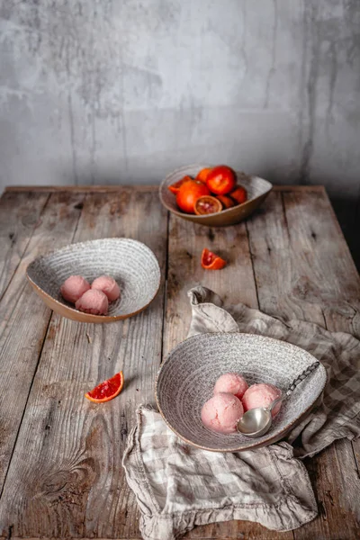 Fresh Orange Ice Cream Scoops Served Ceramic Bowls Wooden Table Royalty Free Stock Photos