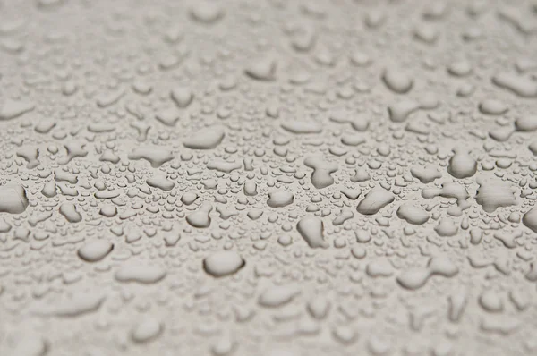 Waterdrops on brushed metal — Stock Photo, Image