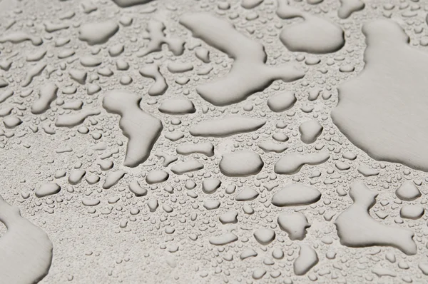 Gotas de agua sobre metal cepillado —  Fotos de Stock